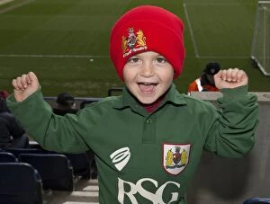Images Dated 11th April 2015: Ecstatic Bristol City Fan Celebrates Sky Bet League One Victory over Preston North End at Deepdale