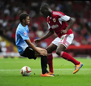 Escaping the Pressure: Jordan Wynter Evades Nahki Wells in Sky Bet League One Clash