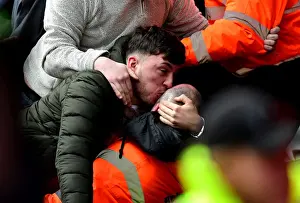 Exultant Cardiff Fan Embraces Steward Amidst Championship Clash: Bristol City vs Cardiff City (14/01/2017)