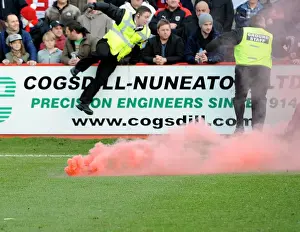 Tamworth V Bristol City Prints: FA Cup: Disruptive Fan Behavior at Tamworth v Bristol City - Stewards Intervene to Remove Flare Throne from Pitch