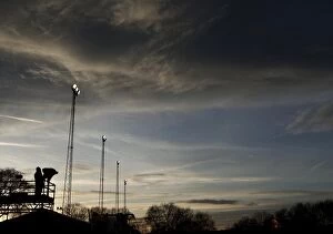 Images Dated 8th December 2013: FA Cup Sunset: ITV Cameraman and Floodlights at Tamworth's The Lamb Ground