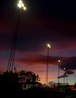 Tamworth V Bristol City Prints: FA Cup Sunset: ITV Cameraman and Floodlights Silhouetted at Tamworth's The Lamb Ground