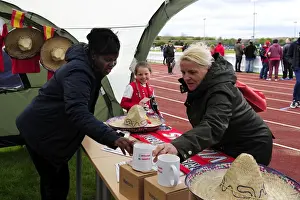 Framed Print : Fan Exploring Bristol Academy Women's Merchandise at Gifford Stadium during BAWFC vs Chelsea Ladies Match