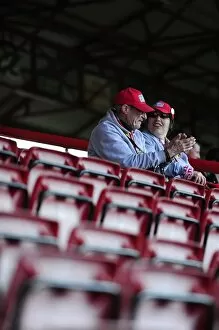 Images Dated 18th April 2014: Two Fans Watch Intently from the East End during Bristol City vs Notts County Football Match, 2014
