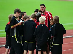 First team players sign autographs for the academy players
