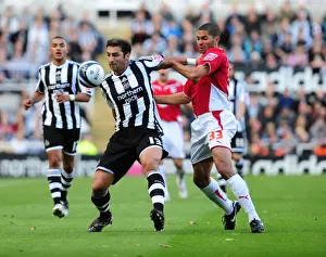 Framed Print : A Force to Reckon With: Khizanishvili and Saborio's Unforgettable Clash - Newcastle Utd vs. Bristol City