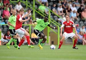 Images Dated 20th July 2013: Forest Green Rovers Alhassan Bangura Outmaneuvers Bristol City's Steven Davis in Preseason Clash