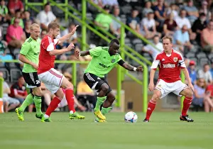 Forest Green Rovers V Bristol City Prints: Forest Green Rovers Alhassan Bangura Outmaneuvers Bristol City's Steven Davis in Preseason Clash