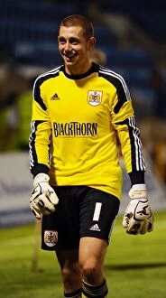 Images Dated 6th August 2013: Frank Fielding's Heroics: Bristol City's Goalkeeper Stuns Gillingham in Capital One Cup