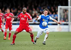 Peterborough United V Bristol City Prints: Frecklington vs Elliott: Battle for Supremacy in Peterborough United vs Bristol City Football Match