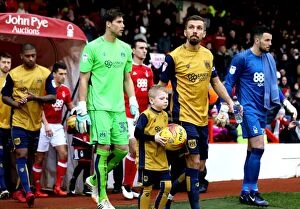 Images Dated 21st January 2017: Gary O'Neil and Young Mascot Lead Bristol City Out at The City Ground
