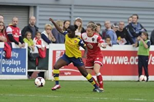 Images Dated 20th September 2014: Grace McCarthy vs Danielle Carter: Intense Moment in BAWFC vs Arsenal Ladies FA WSL Match, 2014