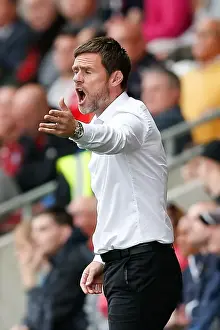 Graham Alexander in Action: Intense Moment at Fleetwood's Highbury Stadium during Fleetwood Town vs