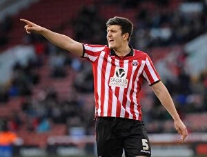 Images Dated 22nd February 2014: Harry Maguire of Sheffield United Faces Off Against Bristol City in Sky Bet League One Clash, 2014