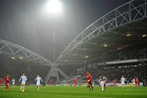 Images Dated 12th December 2015: Huddersfield vs. Bristol City: A Rainy Championship Clash at John Smith's Stadium