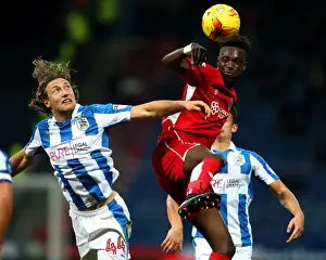 Huddersfield Town V Bristol City Prints: Huddersfield's Hefele Stops Abraham's Charge in Championship Clash