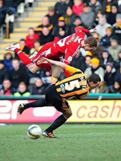 Images Dated 11th February 2012: Hull City vs. Bristol City: Stephen Pearson Fouled by James Chester - Championship Match, 11/02/2012