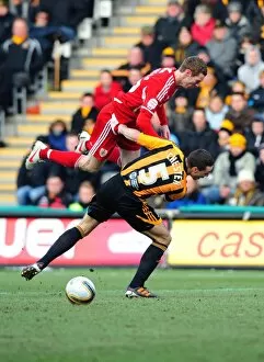 Images Dated 11th February 2012: Hull City's James Chester Fouls Bristol City's Stephen Pearson in Championship Match, 11/02/2012