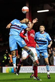 Images Dated 17th April 2012: Intense Aerial Battle: Chris Wood vs. Winston Reid, Bristol City vs. West Ham United