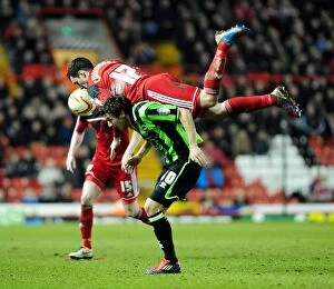Bristol City V Brighton and Hove Albion Collection: Intense Aerial Battle: Cunningham vs Buckley - Bristol City vs Brighton & Hove Albion