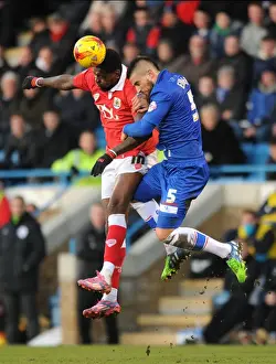 Gillingham V Bristol City Prints: Intense Aerial Battle: Jay Emmanuel-Thomas vs Kortney Hause - Football Rivalry in the Sky