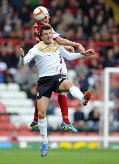 Bristol City V Colchester United Prints: Intense Aerial Battle: Moloney vs Gilbey at Ashton Gate