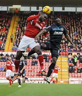 Images Dated 29th December 2013: Intense Aerial Battle: Osborne vs Zoko in Sky Bet League One Clash