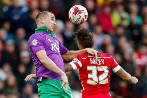 Barnsley V Bristol City Prints: Intense Aerial Battle: Wilbraham vs Bailey at Oakwell Stadium - Football Rivalry in the Sky