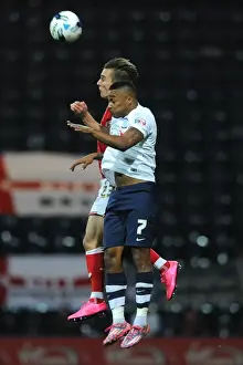 Intense Aerial Clash: Joe Bryan vs Chris Humphrey at Deepdale Stadium