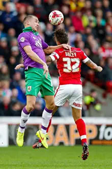Barnsley V Bristol City Prints: Intense Aerial Clash: Wilbraham vs Bailey at Barnsley's Oakwell Stadium