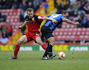 Intense Battle for Possession: Liam Kelly vs