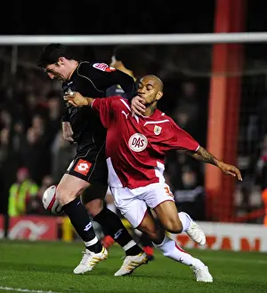 Bristol City V Barnsley Prints: Intense Championship Clash: Haynes vs Macken's Battle for Possession