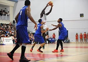 Bristol Flyers v Plymouth Raiders Collection: Intense Defence Clash: Bristol Flyers vs. Plymouth Raiders in British Basketball League at SGS