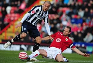 Images Dated 21st February 2010: Intense Football Championship Clash: Louis Carey Tackles Roman Bednal - Bristol City vs