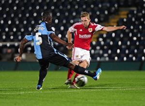 Images Dated 8th October 2013: Intense Football Rivalry: Bristol City vs Wycombe Wanderers in the Johnstone's Paint Trophy