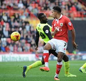 Images Dated 1st November 2014: Intense Moment: Korey Smith vs. Jabo Ibehre in Bristol City's Battle against Oldham Athletic