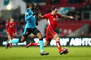 Framed Print : Intense Moment: Lee Tomlin vs Amari Bell - FA Cup Clash at Ashton Gate