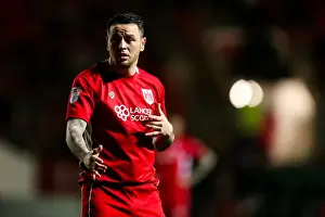 Intense Moment: Lee Tomlin's Focused Gaze at Huddersfield Town, Ashton Gate, 2017