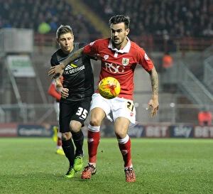 Images Dated 17th February 2015: Intense Moment: Marlon Pack Fends Off Harry Beautyman's Pressure at Ashton Gate