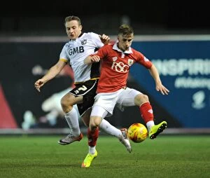 Images Dated 10th February 2015: Intense Rivalry: Bryan vs Birchall Battle for the Ball in Bristol City vs Port Vale