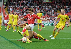 Bristol City V MK Dons Prints: Intense Rivalry: Carruthers vs. Freeman - A Football Battle at Ashton Gate