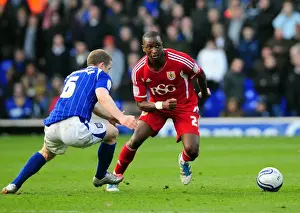 Ipswich Town V Bristol City Prints: Intense Rivalry: Cisse vs Leadbitter in the Heart of the Football Battle at Portman Road