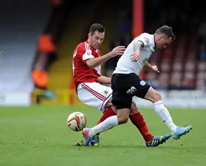 Bristol City V Peterborough Prints: Intense Rivalry: Cunningham vs Swanson - A Football Battle at Ashton Gate