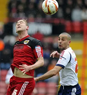 Bristol City V Bolton Wanderers Prints: Intense Rivalry: Davies vs. Pratley - Battle for Championship Dominance
