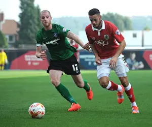 Intense Rivalry: Derrick Williams vs Neil Bishop - A Football Battle at Ashton Gate