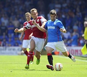 Images Dated 13th July 2013: Intense Rivalry on the Field: Liam Kelly vs. Richard Foster Clash at Ashton Gate