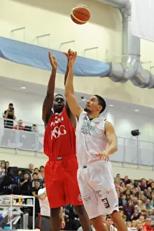 Bristol Flyers V Plymouth Raiders BBL Cup Prints: Intense Rivalry: Flyers vs. Raiders Basketball Clash at Wise Campus - A Fight for the Ball