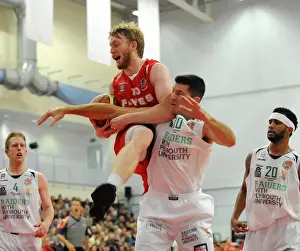 Bristol Flyers V Plymouth Raiders BBL Cup Prints: Intense Rivalry: Flyers vs. Raiders Clash in British Basketball Cup at Wise Campus