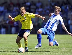 Images Dated 6th July 2013: Intense Rivalry: A Football Battle - Rhys Jordan vs. Adi Adams