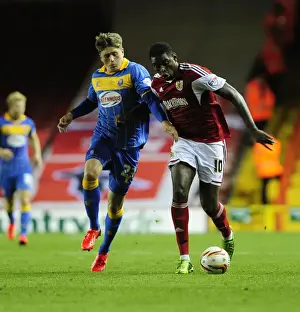 Bristol City V Shrewsbury Town Prints: Intense Rivalry: Jay Emmanuel-Thomas vs Adam Reach in a Hard-Fought Battle for Possession